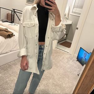 Distressed white denim jean jacket